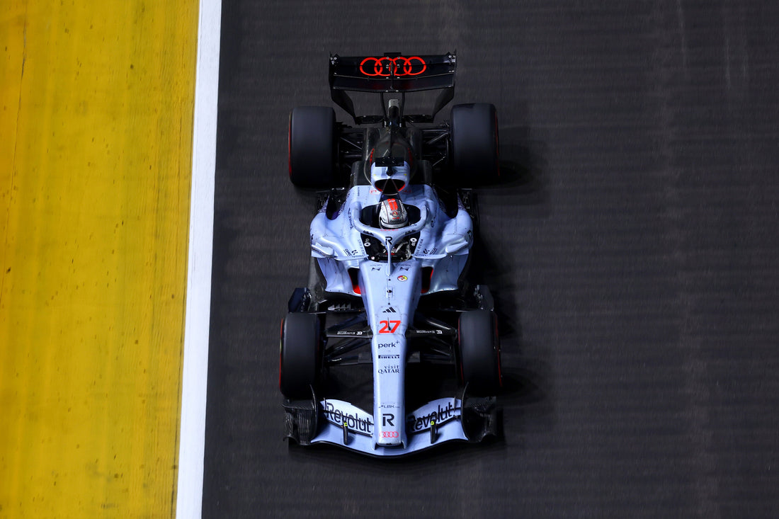 Nico Hülkenberg racing the Audi R26 under the lights at the 2026 Singapore Grand Prix