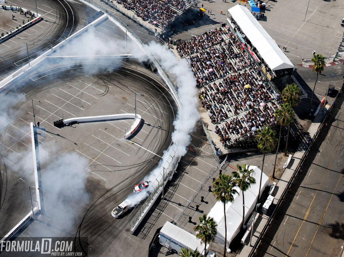 Aerial view of Formula DRIFT competition on the Streets of Long Beach with grandstands and tire smoke. Photo supplied by Formula DRIFT.